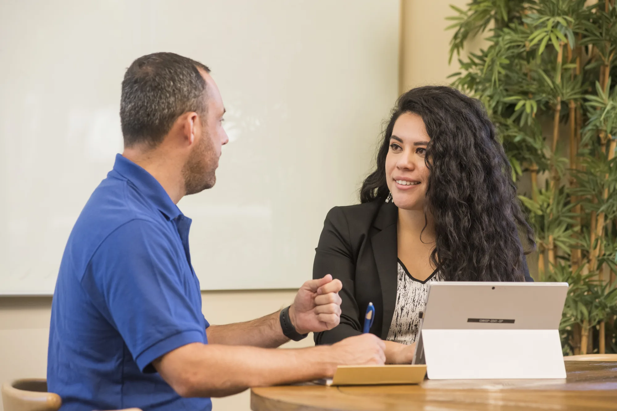 Palmetto Goodwill Snap2Work career advisor / Success Coach assisting a job-seeking customer during a meeting.