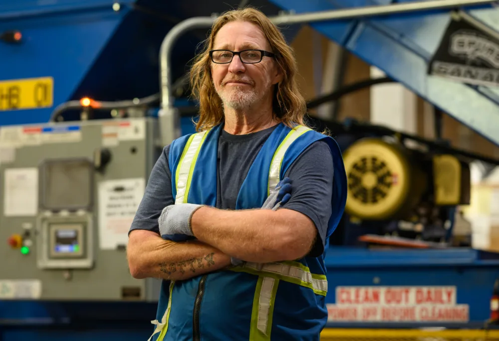 Disabled veteran working in Palmetto Goodwill operations, showcasing stable, supported employment through the AbilityOne Program.