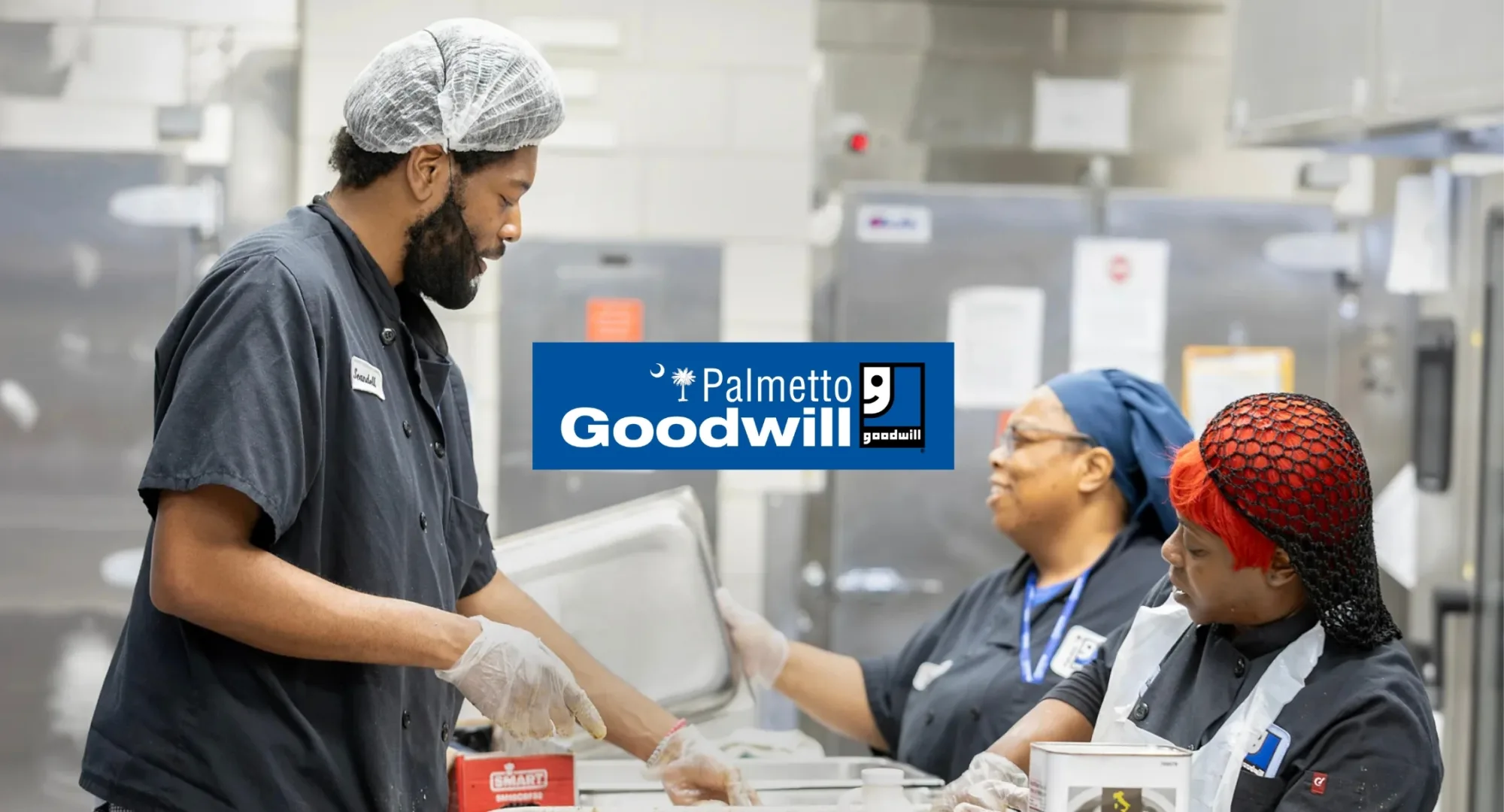 Palmetto Goodwill logo over an integrated team working in food service, showcasing supported employment through the Enclave Program for SC disability employment.