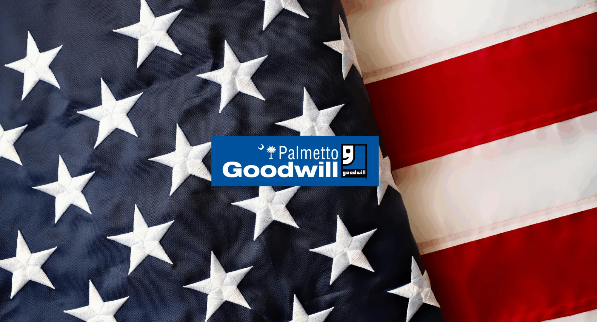 Palmetto Goodwill logo overlaid on the American flag, symbolizing the organization's commitment to veteran career support South Carolina and employment services.