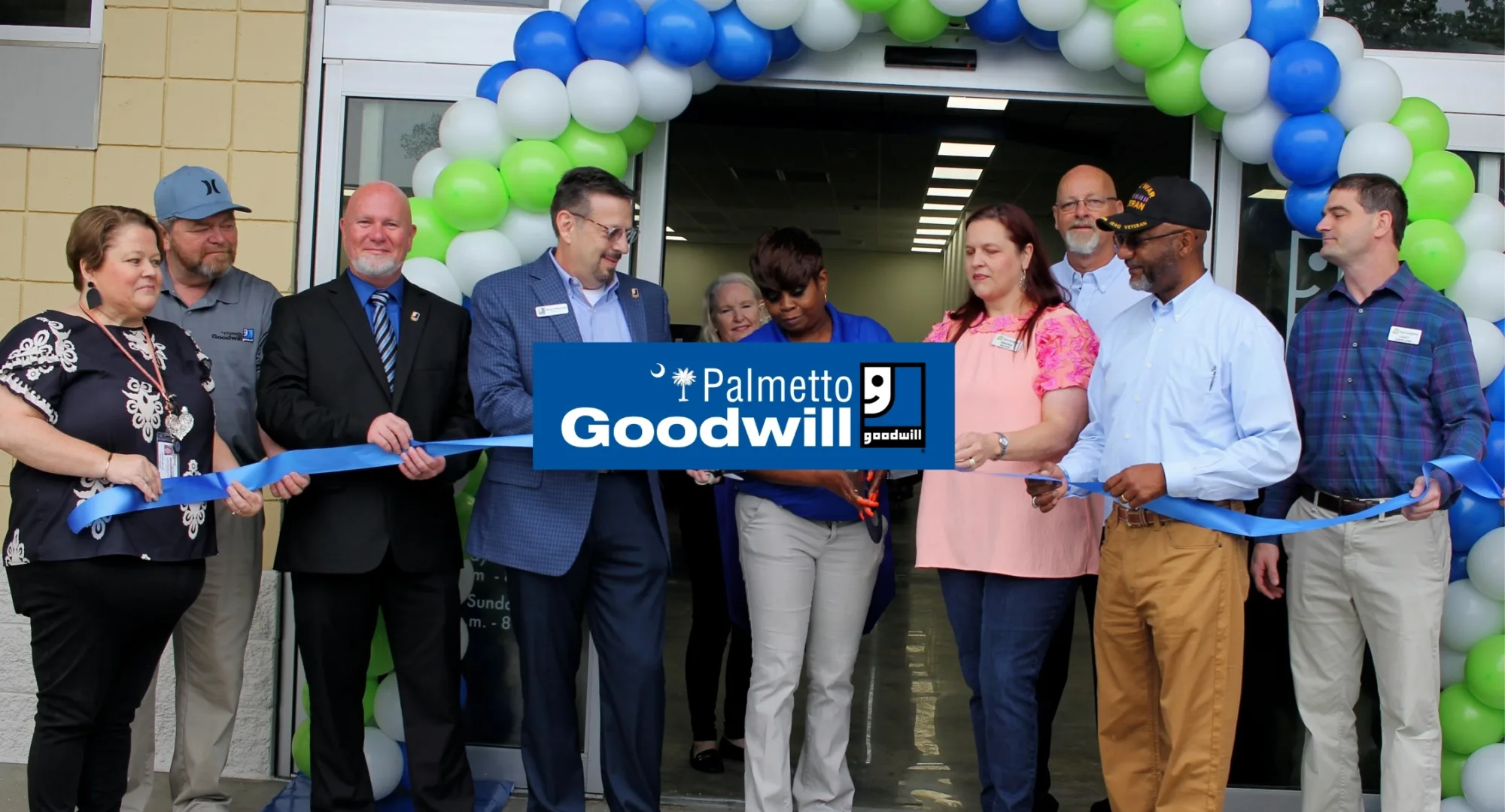 Palmetto Goodwill President and CEO Brian Itzkowitz and team cutting a ribbon at a new store opening, demonstrating why we are the best thrift store SC residents trust for quality and mission.