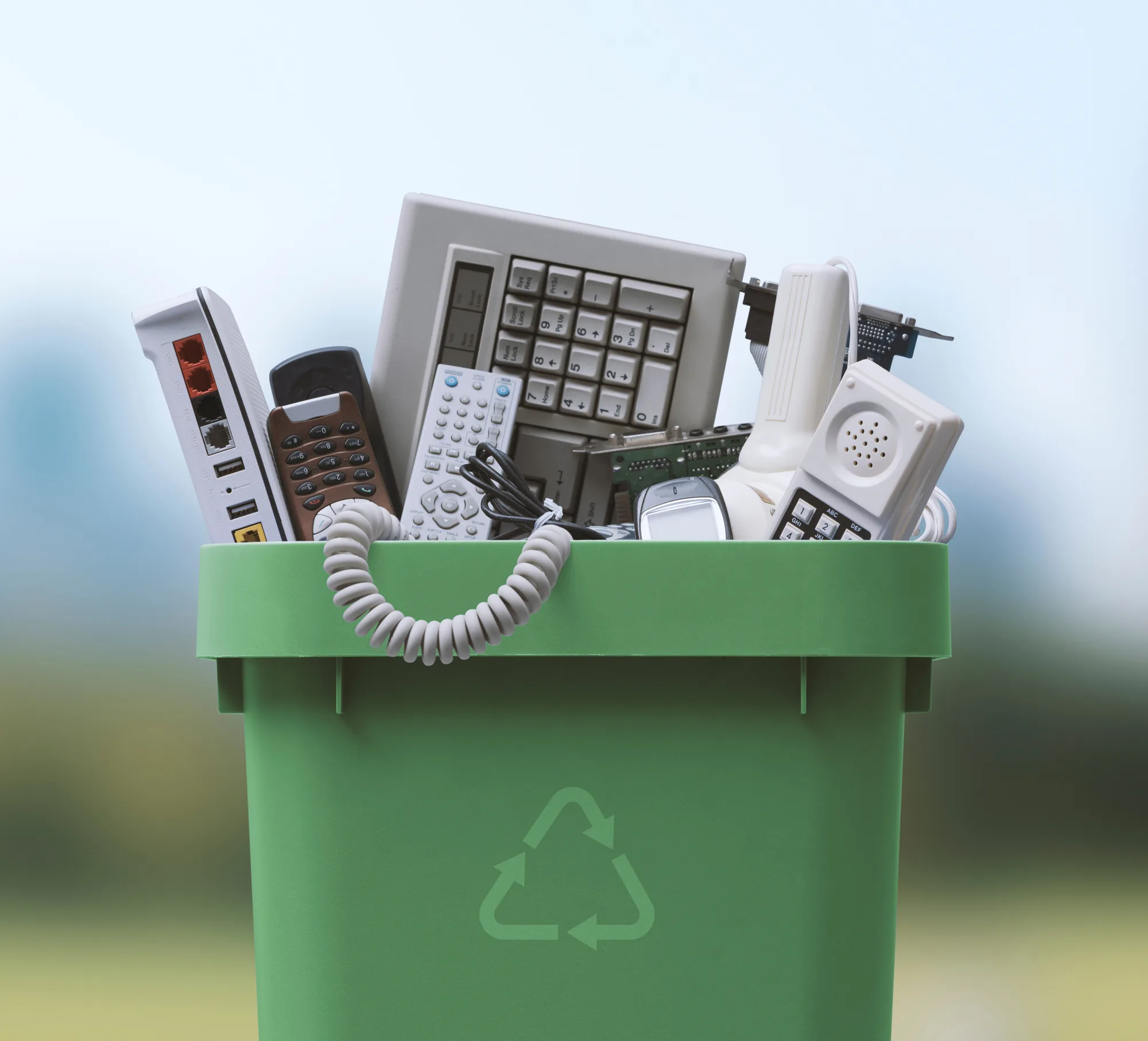 A recycling bin full of electronics